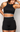 Modelo usando Shorts Personnalité Canelado com Listra Preto e Cinza da MK Fitwear